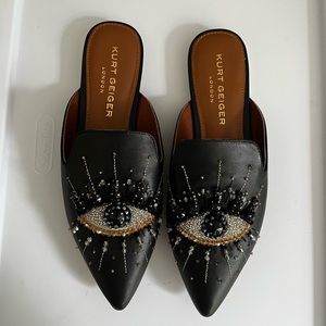 Kurt Geiger black mules with embellished eye. Black with colored rhinestones.